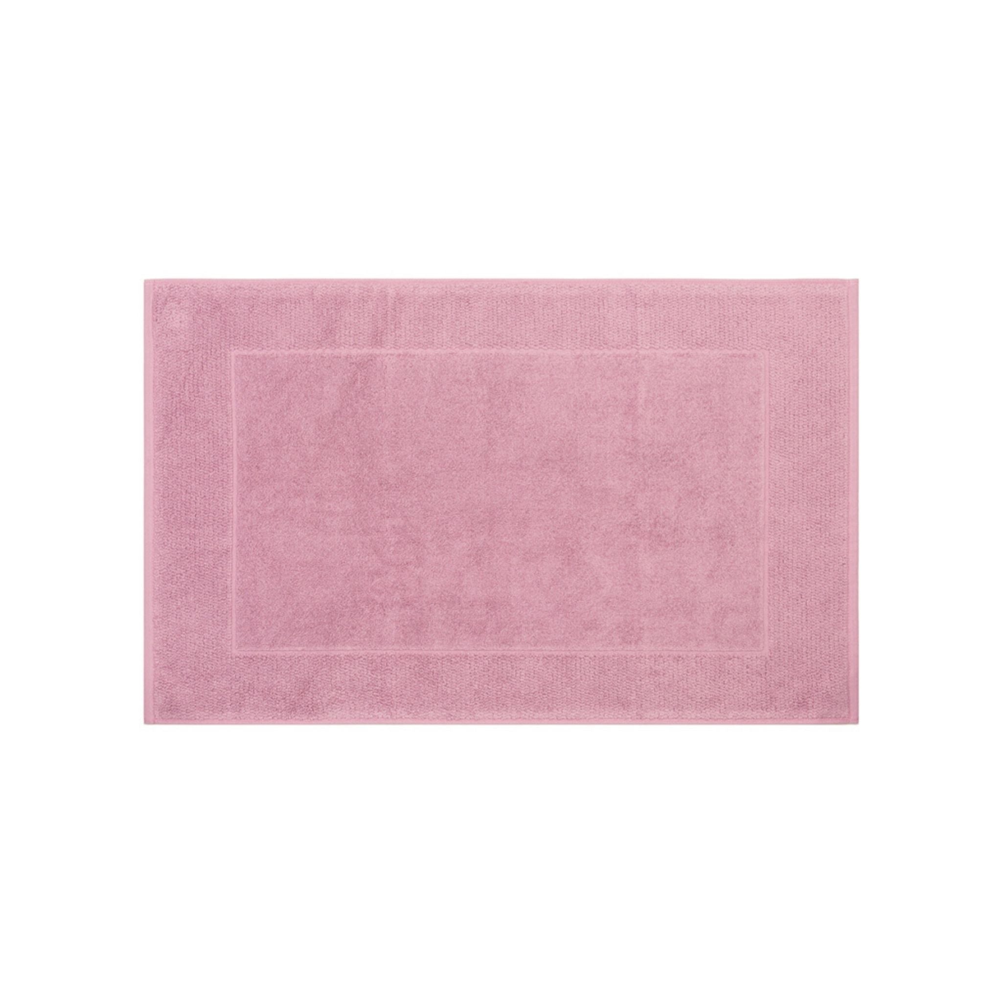 Old pink bath mat