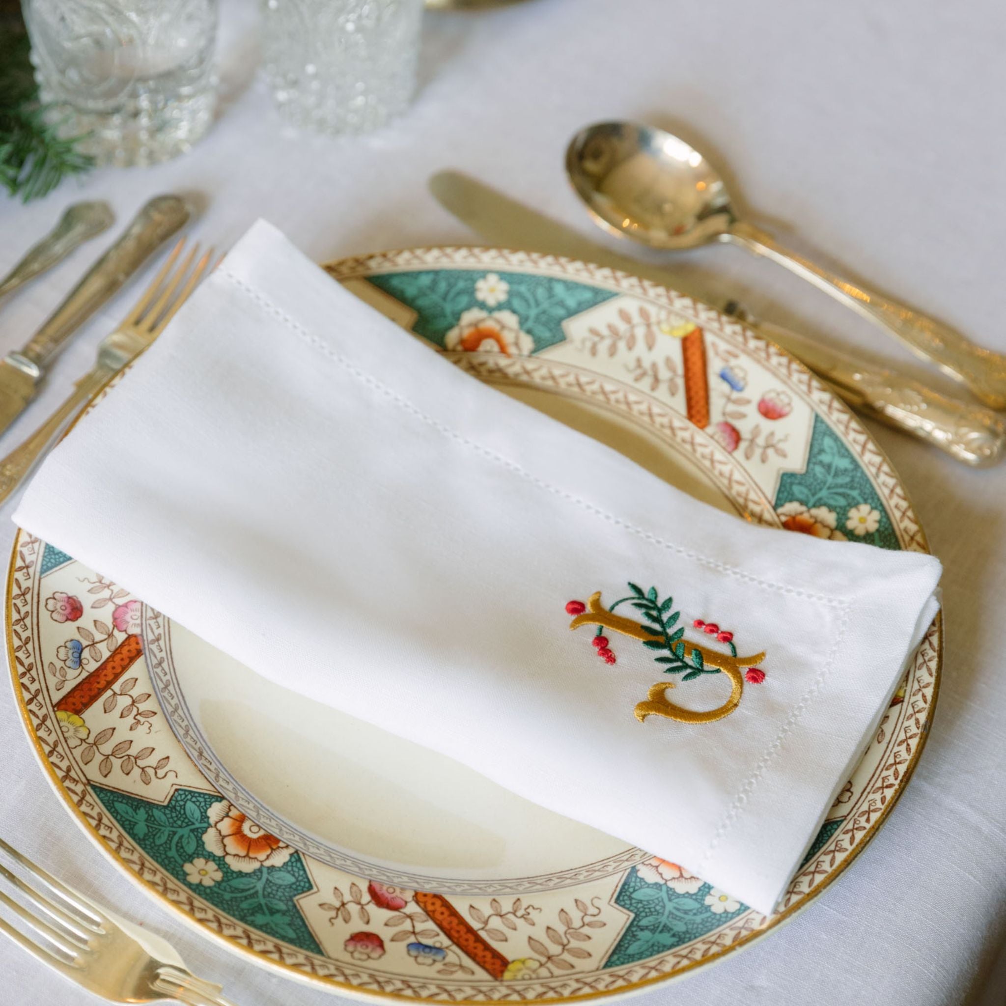 Servilletas Mafra bordadas con letras navideñas doradas (Set de 2)