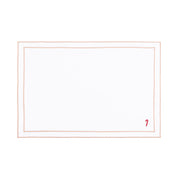 Linge de table Nazaré blanc, en coton, avec des petits motifs de Noël brodés.