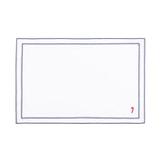 Linge de table Nazaré blanc, en coton, avec des petits motifs de Noël brodés.