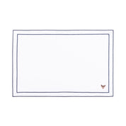 Linge de table Nazaré blanc, en coton, avec des petits motifs de Noël brodés.