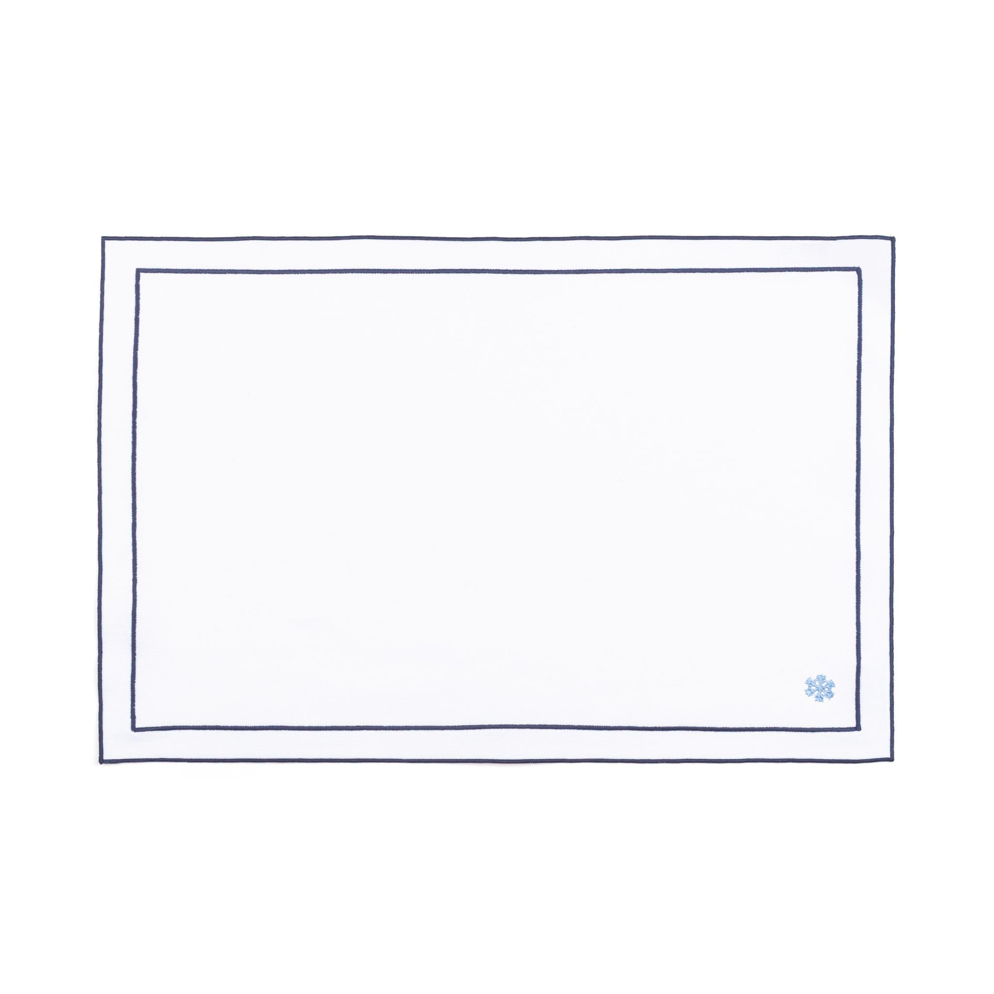 Linge de table Nazaré blanc, en coton, avec des petits motifs de Noël brodés.