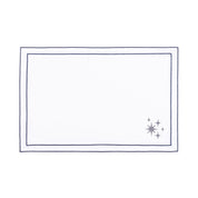 Linge de table Nazaré blanc, en coton, avec des petits motifs de Noël brodés.