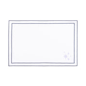 Linge de table Nazaré blanc, en coton, avec des petits motifs de Noël brodés.