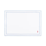 Linge de table Nazaré blanc, en coton, avec des petits motifs de Noël brodés.