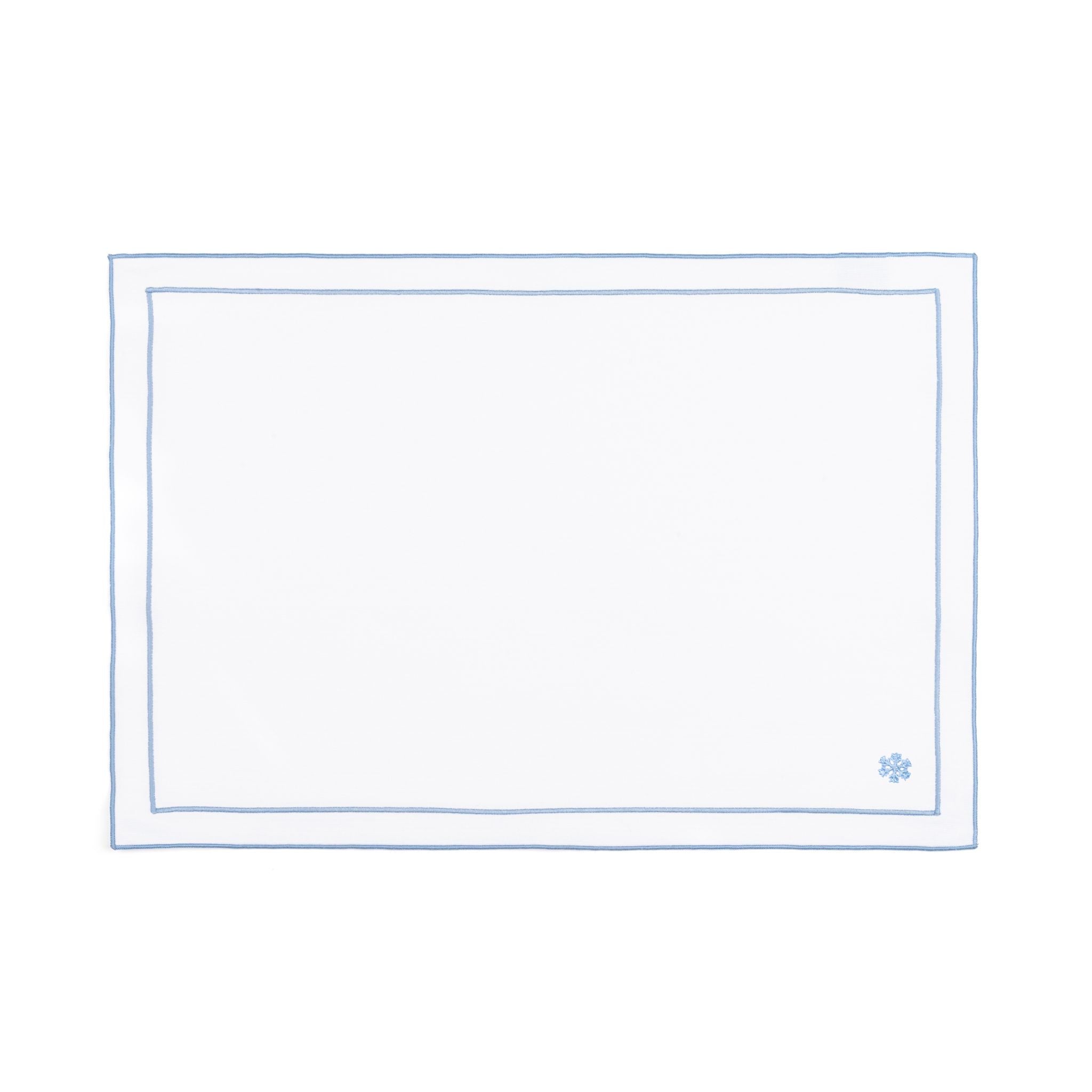 Linge de table Nazaré blanc, en coton, avec des petits motifs de Noël brodés.