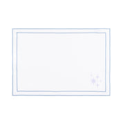 Linge de table Nazaré blanc, en coton, avec des petits motifs de Noël brodés.