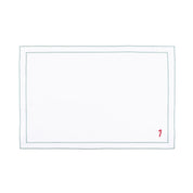 Linge de table Nazaré blanc, en coton, avec des petits motifs de Noël brodés.