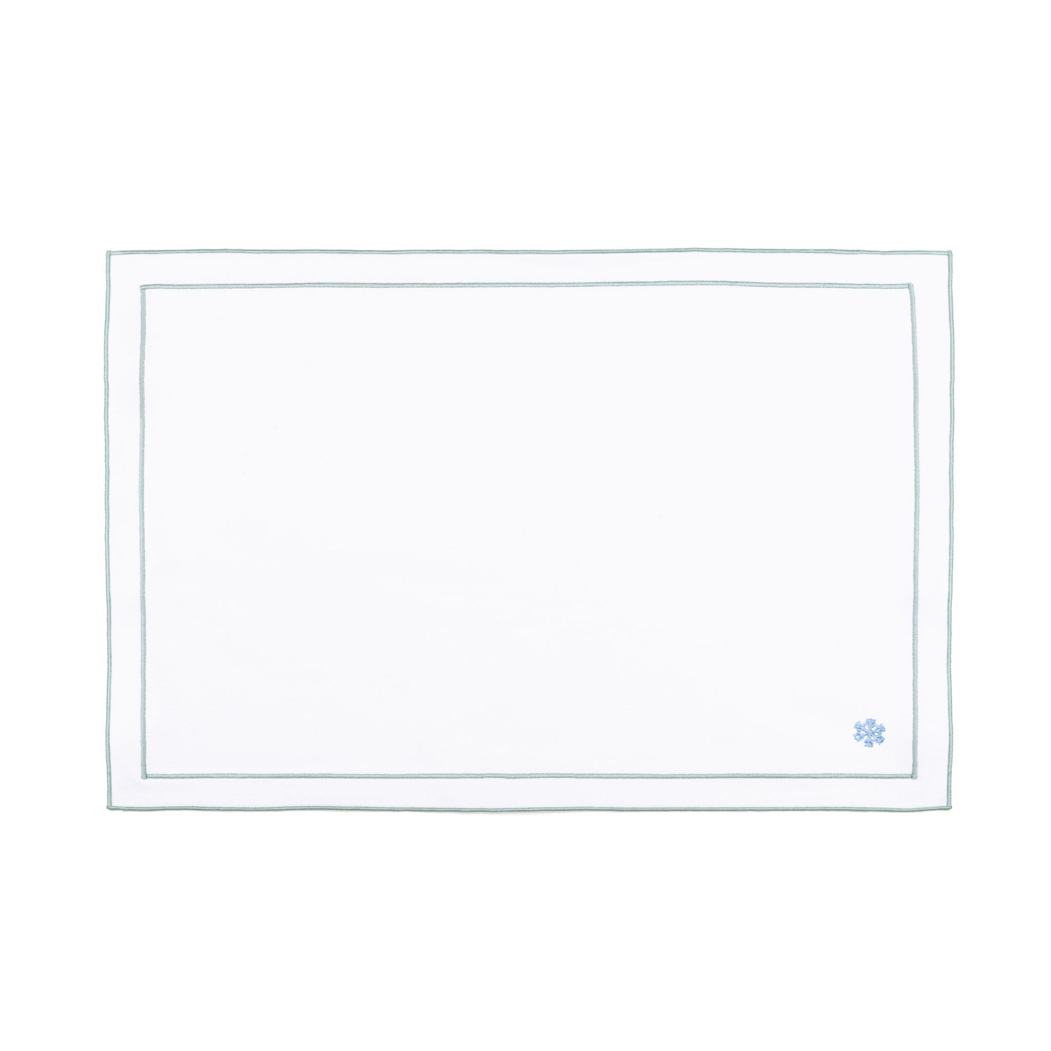 Linge de table Nazaré blanc, en coton, avec des petits motifs de Noël brodés.