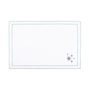 Linge de table Nazaré blanc, en coton, avec des petits motifs de Noël brodés.