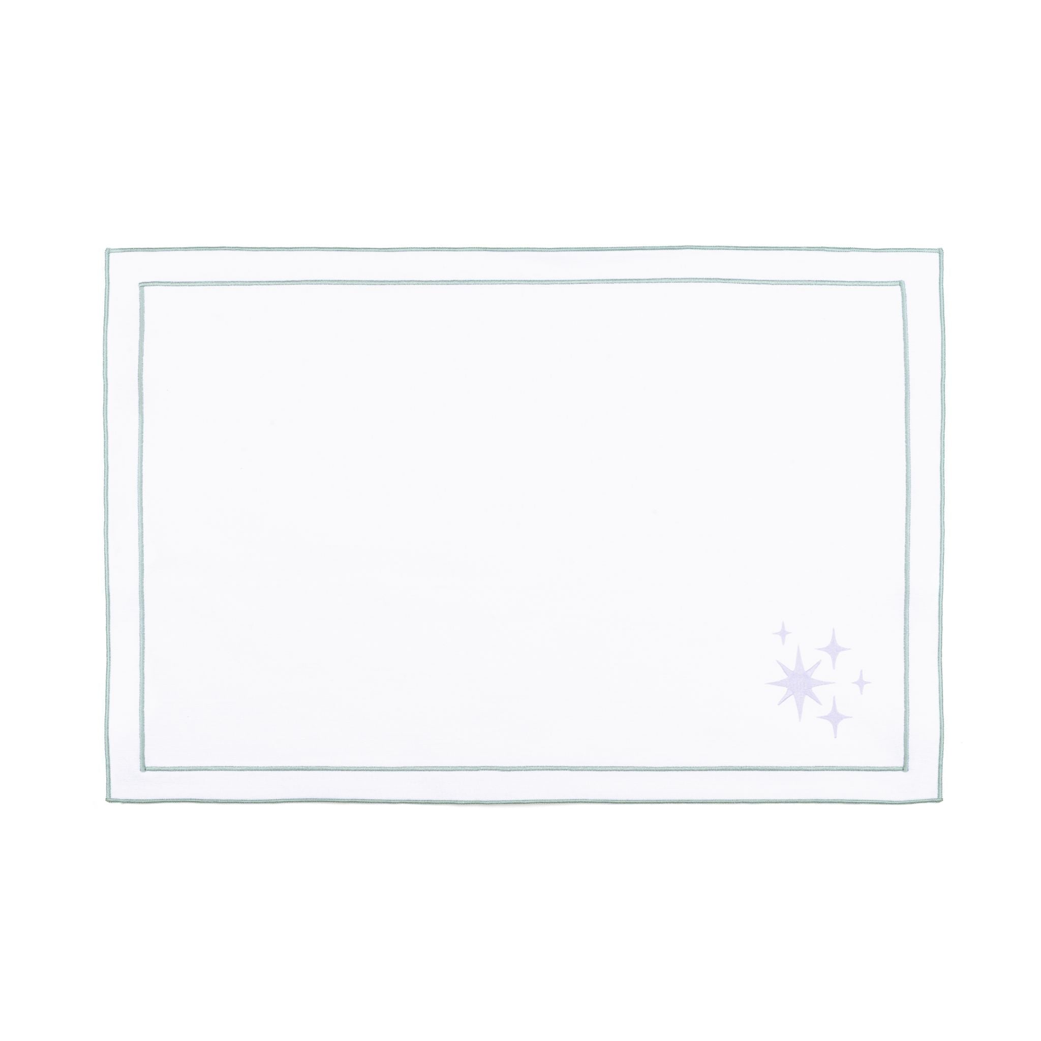 Linge de table Nazaré blanc, en coton, avec des petits motifs de Noël brodés.