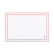 Linge de table Nazaré blanc, en coton, avec des petits motifs de Noël brodés.