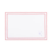 Linge de table Nazaré blanc, en coton, avec des petits motifs de Noël brodés.