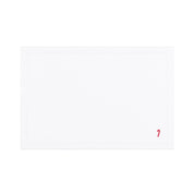 Linge de table Nazaré blanc, en coton, avec des petits motifs de Noël brodés.