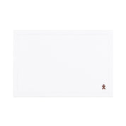 Linge de table Nazaré blanc, en coton, avec des petits motifs de Noël brodés.