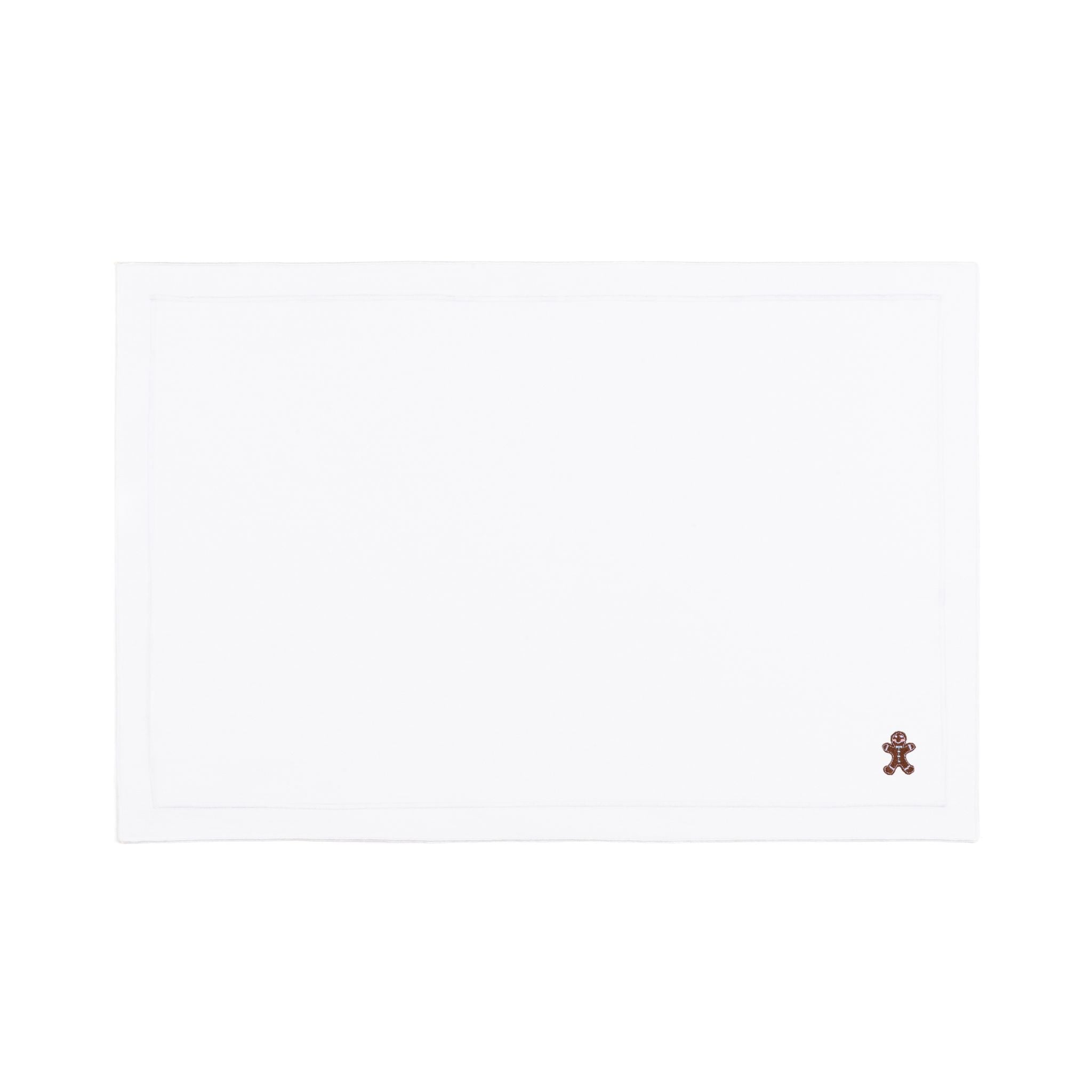 Linge de table Nazaré blanc, en coton, avec des petits motifs de Noël brodés.