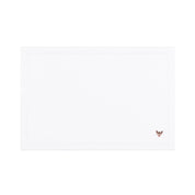 Linge de table Nazaré blanc, en coton, avec des petits motifs de Noël brodés.